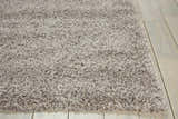 Close-up of the plush texture and light gray color of the Nourison Amore Shag Area Rug.