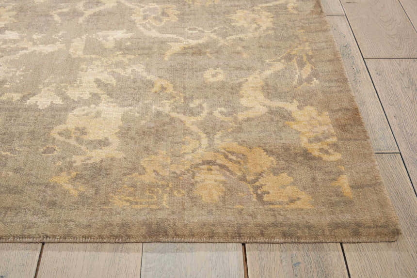 Close-up of a Nourison Silken Allure Moss rug. Olive tones with a vintage floral pattern and soft, plush texture.
