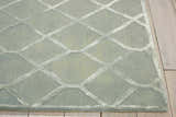Close up of Nourison Vita Sage rug showing diamond trellis pattern and soft, muted sage color.