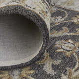 Close-up of the Feizy Eaton Traditional Oriental rug in blue, gray, and taupe, showing wool texture and cotton backing. Fold