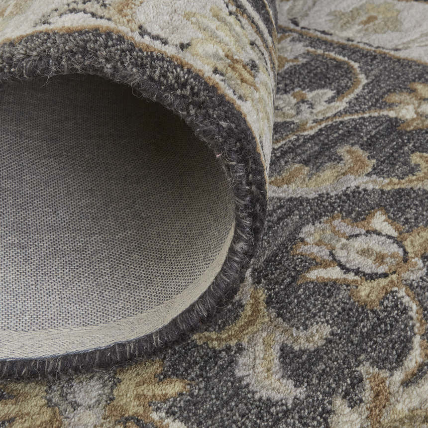 Close-up of the Feizy Eaton Traditional Oriental rug in blue, gray, and taupe, showing wool texture and cotton backing. Fold