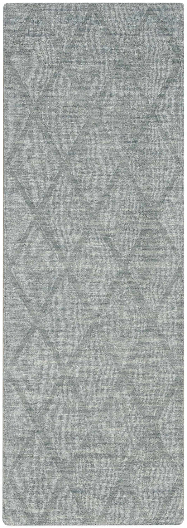 Close-up of the Nourison Wool Haven Blue rug, a handmade wool rug with a subtle diamond pattern and soft, light blue tones.