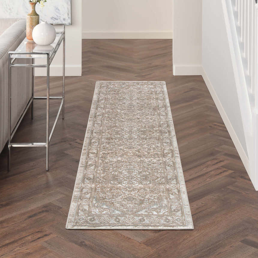 Hallway with Nourison Quarry Beige Vintage runner rug on herringbone wood floor.