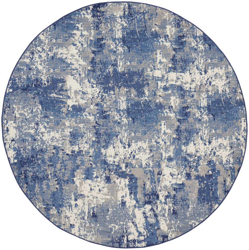 Close-up of the round Nourison Grafix Navy Blue rug, featuring a modern abstract pattern in shades of blue, gray, and white.