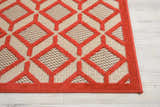 Close-up of Nourison Aloha Red rug showing geometric diamond pattern and textured weave.