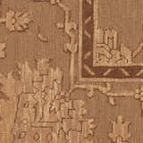 Close-up of the brown vintage pattern and texture of the Nourison Silk Pointe Area Rug.