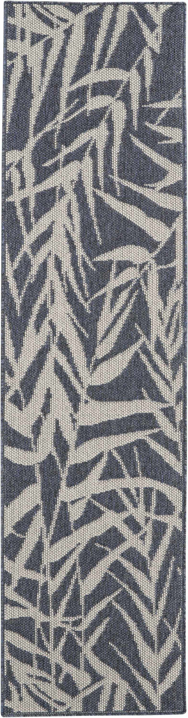 Close-up of the Nourison Aruba Slate/Cream Beach Area Rug showing its leaf pattern and textured weave.