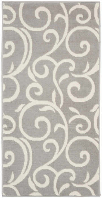 Close-up of the Nourison Grafix Grey Contemporary Indoor Area Rug with a swirling ivory vine pattern.