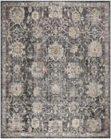 Close-up of the Nourison Oushak Home Charcoal Vintage Area Rug, featuring a floral taupe pattern on a dark gray background.