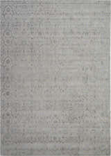 Close-up of Nourison Opaline Taupe Vintage Area Rug. Handmade rug with ivory and silver floral pattern.
