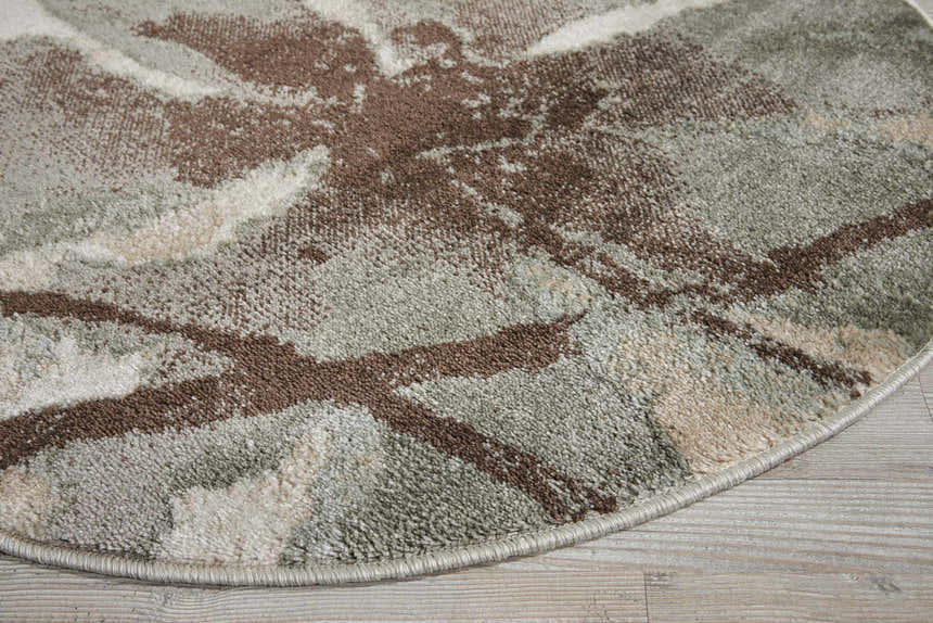 Close up of the round Nourison Euphoria Ivory rug, showing chestnut, ivory, and sage green tones.
