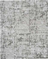 Close-up of the Nourison Symmetry Ivory/Taupe rug. Abstract, mid-century modern design with ivory and taupe colors. Handmade polyester rug.