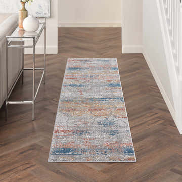 Hallway with Nourison Rustic Textures Multicolor runner rug, wood floors, console table, and neutral decor.