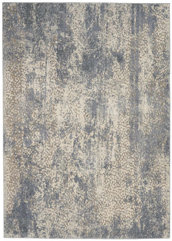 Close-up of Nourison Sahara Ivory/Slate rug. Artistic design in ivory, slate blue, and chestnut colors. Abstract pattern.