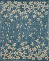 Close-up of the Nourison Tranquil Turquoise rug featuring a floral pattern with aqua, pink, and beige flowers.
