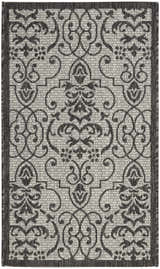 Close-up of Nourison Country Side Ivory/Charcoal rug. Transitional farmhouse style with taupe floral and geometric pattern.