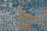 Close-up of the Feizy Cadiz rug. Abstract design in textured blue, gray, and gold acrylic, cotton, and viscose. Texture
