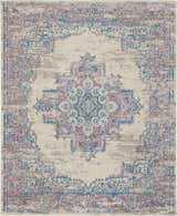 Close-up of the Nourison Grafix Ivory Pink Vintage Area Rug, featuring a faded traditional design in pink, blue, and chestnut tones.