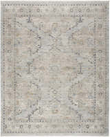 Close-up of the Nourison Lynx Light Blue Vintage Area Rug featuring a faded traditional pattern and high pile texture.