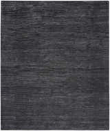 Close-up of the Nourison OCEAN Onyx rug. Black rug with subtle, horizontal striations. Handmade, modern style.
