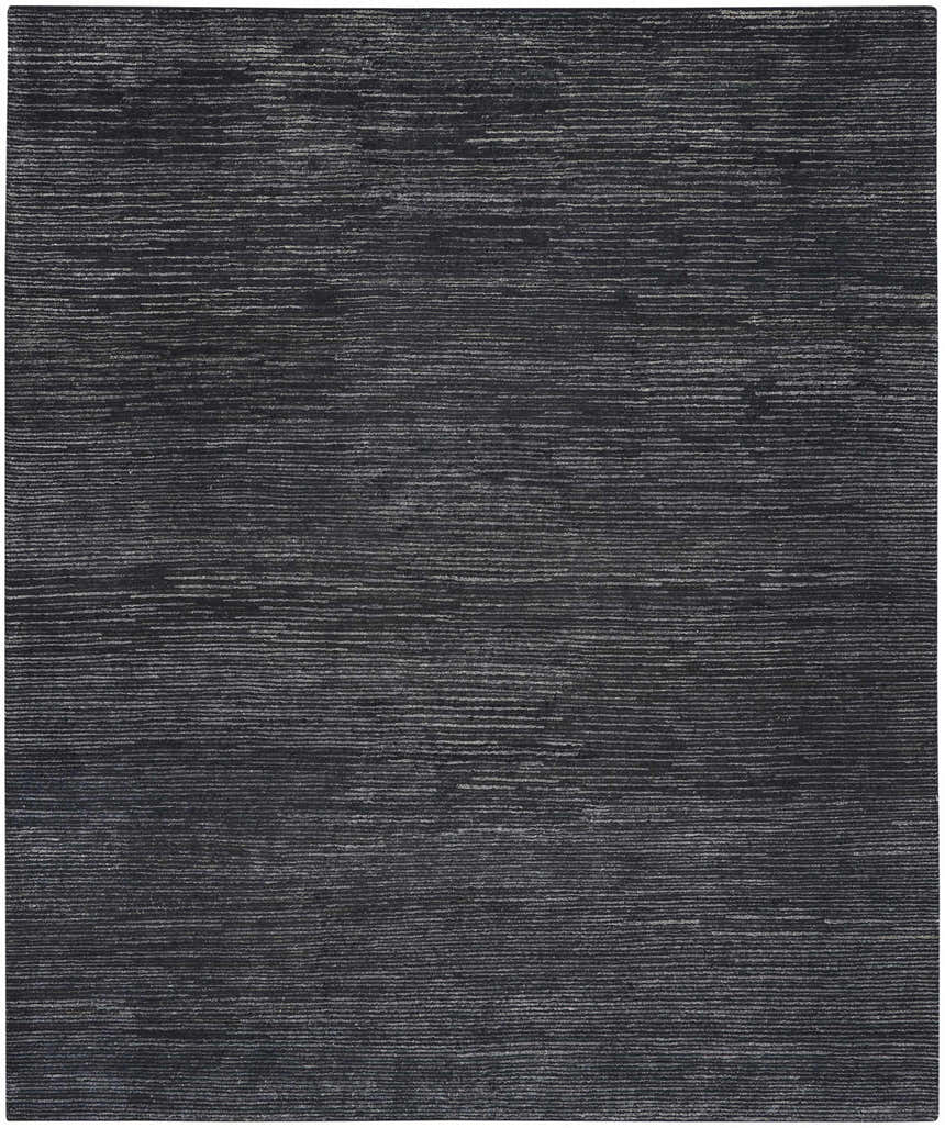 Close-up of the Nourison OCEAN Onyx rug. Black rug with subtle, horizontal striations. Handmade, modern style.
