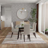 Dining room with Feizy Gilmore Ivory/Orange/Gray rug, glass table, and neutral chairs. Modern, bright space. Roomscene-Rectangle