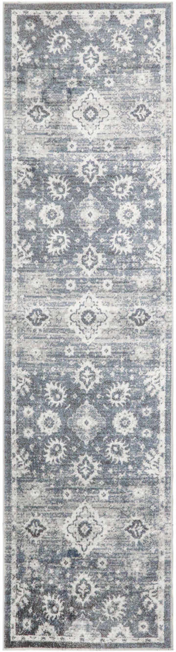 Close-up of the Nourison Astra Denim Vintage rug; a machine-made runner with a faded blue floral pattern.