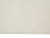 Close-up of the Calvin Klein Pretoria Ivory rug, showing its subtle grid pattern and soft mohair wool texture.