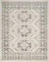 Close-up of Nourison Serenity Home Ivory Grey Vintage rug. High pile rug with chestnut accents and geometric pattern.