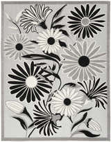 Close-up of the Nourison Aloha Black White Outdoor Area Rug featuring a floral design in black, white, and gray.