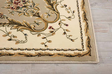 Close up of the cream Nourison Bordeaux Aubusson rug. Floral pattern in cream, gold, and green. Machine-made polypropylene rug.