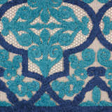 Close-up of the Nourison Aloha Navy Bohemian Area Rug, featuring a textured floral design in navy and teal.