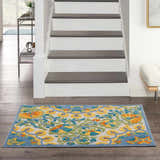 Entryway with Nourison Aloha Multicolor Transitional Area Rug, wood floors, white stairs, and modern decor.