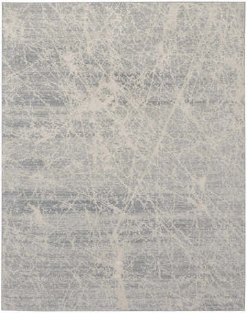 Close-up of the Nourison Exhale Ivory Grey rug, featuring a high pile and modern abstract pattern.