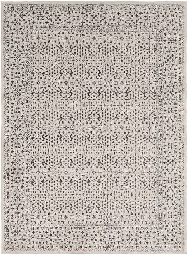 Close-up of Sattley Area Rug. Beige rug with charcoal, floral-inspired, geometric pattern and traditional border. Design-Rectangle-5373