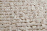 Close-up of the plush, snow white shag texture of the Nourison Fantasia area rug.