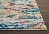 Close-up of the Nourison Fusion Cream Multicolor rug, showing its abstract pattern and texture on a dark wood floor.
