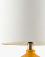 Soft Orange Modern Table Lamp with global details for bedside or console tables