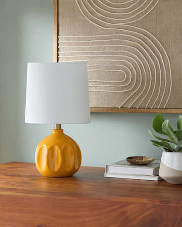 Soft Orange Modern Table Lamp with global details for bedside or console tables