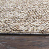 Close-up of the hand-tufted Rizzy BR360A area rug. Dark red and white wool fibers create a textured, casual design. Pile