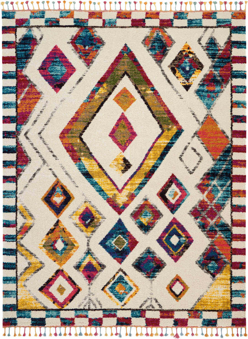Close-up of Nourison Nomad Ivory Multicolor Tribal rug. Diamond pattern, tassels, chestnut, blue, and orange colors.