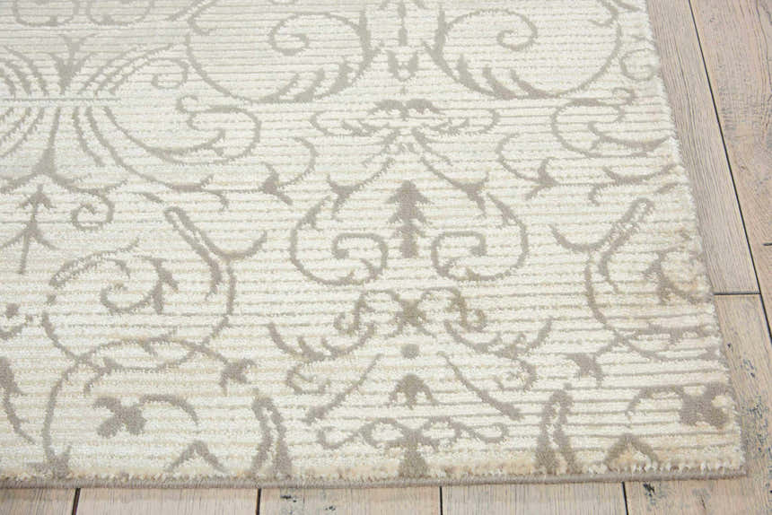 Close up of the Nourison Luminance Opal Vintage rug, showcasing its soft opal color and intricate vintage pattern.