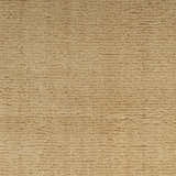 Close-up of the plush, textured pile of the Nourison Plush Cloud Camel area rug.