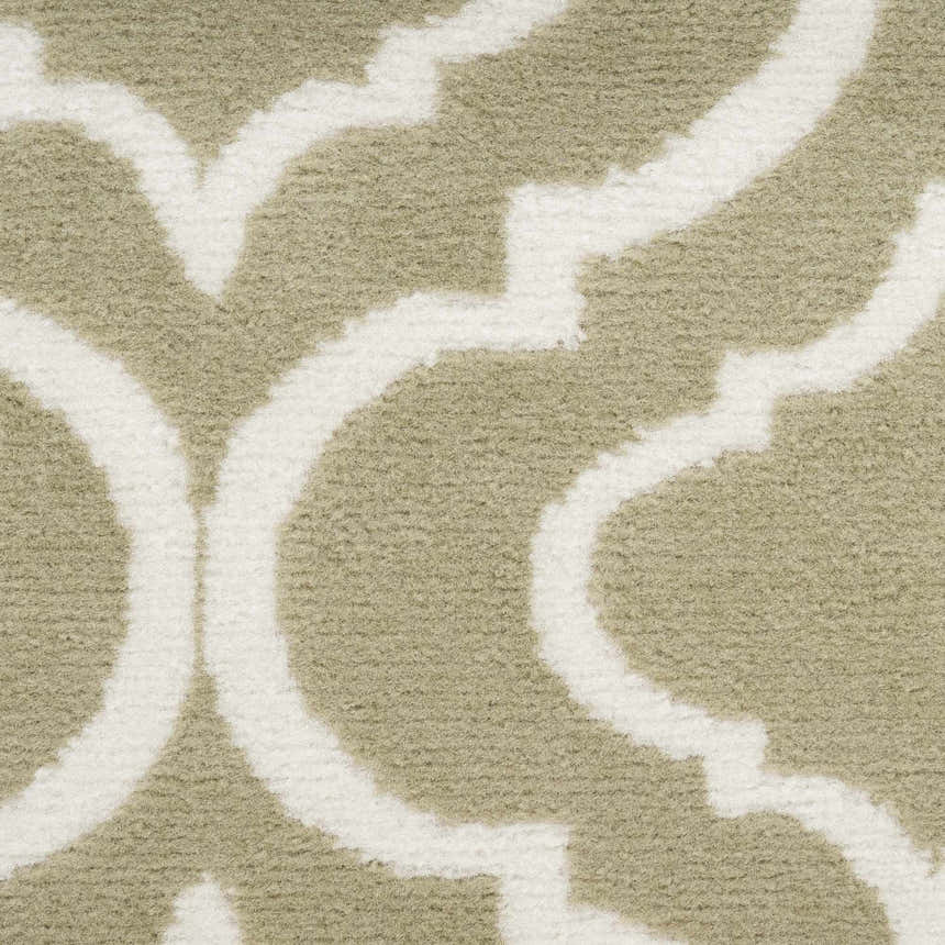 Close-up of the Nourison Jubilant Olive rug showing its contemporary white geometric pattern against an olive background.