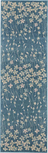 Close-up of the Nourison Tranquil Turquoise rug. Aqua rug with a floral pattern in cream, pink, and blue. Contemporary style.