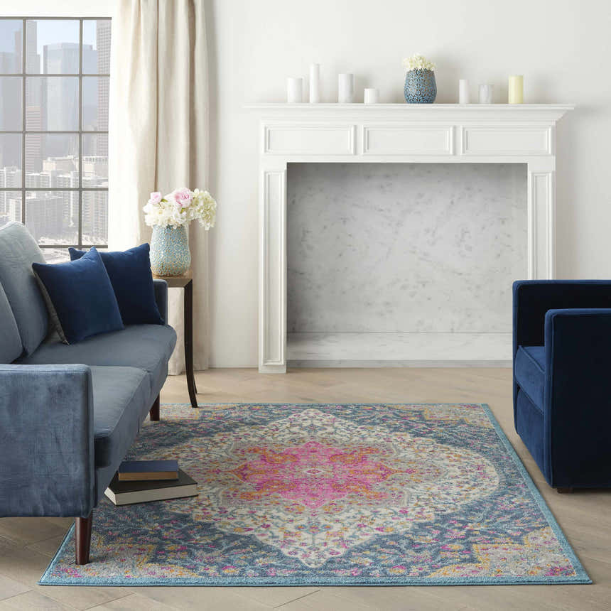 Living room scene with blue sofas and Nourison Passion Multicolor Farmhouse Indoor Area Rug.