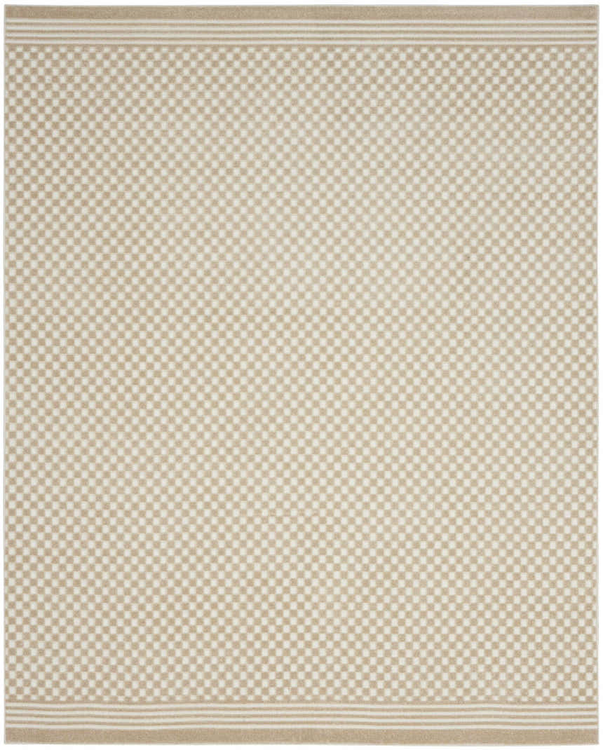 Close-up of the Nourison Care Free Beige rug, featuring a small-scale checkerboard pattern and striped borders.