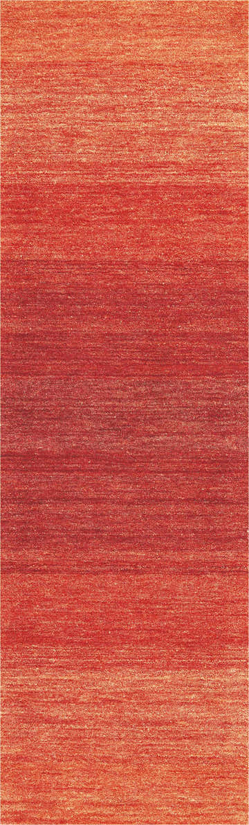 Close-up of Calvin Klein Linear Glow Sumac rug. Handmade wool runner with horizontal linear pattern in shades of red and orange.