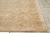 Close up of the Sand Nourison Silken Allure rug showing sandstone color and subtle floral design.