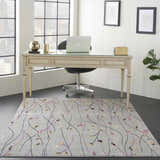 Contemporary office with Nourison Grafix Grey area rug featuring floral vine pattern under a glass-top desk.